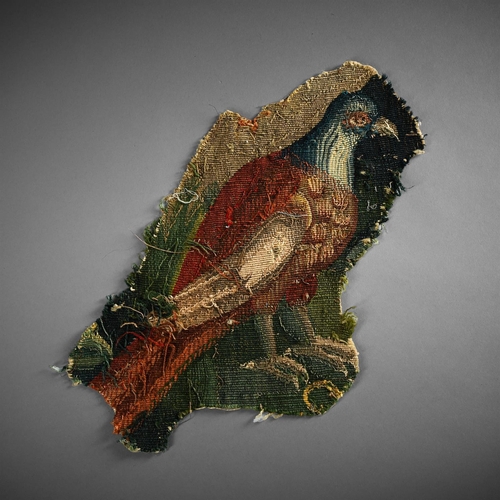 746 - A FRAGMENT OF AN ENGLISH TAPESTRY DEPICTING A HAWK LATE 17TH CENTURY Unmounted 47.5cm long overall, ... 