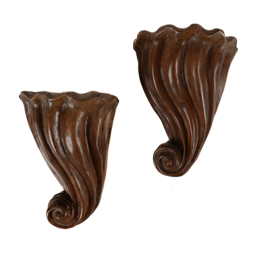 769 - A PAIR OF CARVED WALNUT WALL BRACKETS 20TH CENTURYEach of drawn scrolled form35cm high, 25cm wide, 1... 