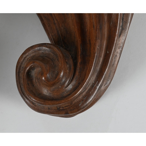 769 - A PAIR OF CARVED WALNUT WALL BRACKETS 20TH CENTURYEach of drawn scrolled form35cm high, 25cm wide, 1... 