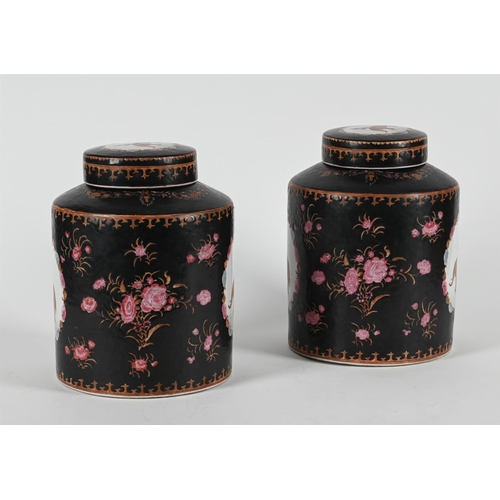 784 - A PAIR OF CHINESE EXPORT STYLE FAMILLE NOIRE CANNISTERS AND COVERS LATE 20TH CENTURY31cm high