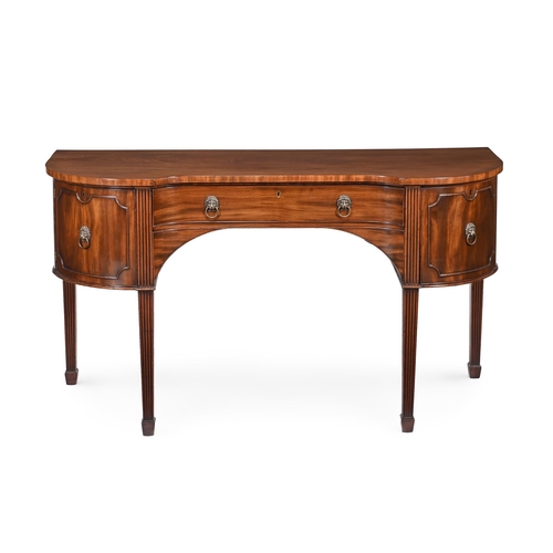 786 - A LATE GEORGE III MAHOGANY SIDEBOARD CIRCA 1810 Of swept inverted breakfront form, with a frieze dra... 