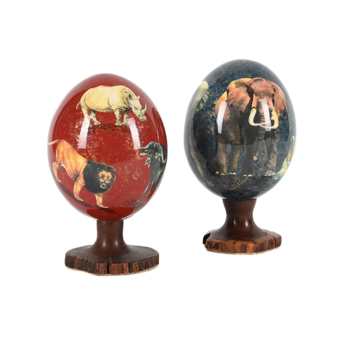 799 - λ SHERRY ROWE (SOUTH AFRICAN, CONTEMPORARY), TWO MODERN DECOUPAGE OSTRICH EGGS Decorated in mega fau... 