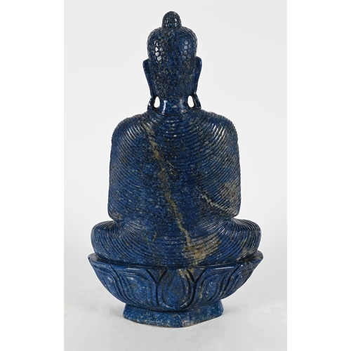 801 - A LARGE LAPIS LAZULI MODEL OF A BUDDHA20TH CENTURYSeated on a lotus thrown45cm high