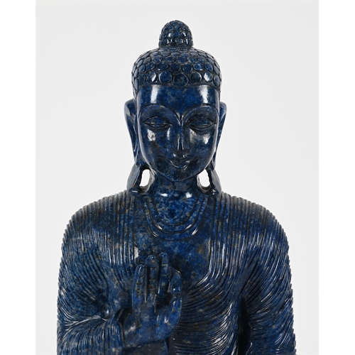 801 - A LARGE LAPIS LAZULI MODEL OF A BUDDHA20TH CENTURYSeated on a lotus thrown45cm high