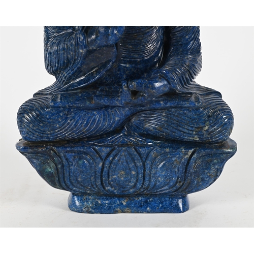 801 - A LARGE LAPIS LAZULI MODEL OF A BUDDHA20TH CENTURYSeated on a lotus thrown45cm high