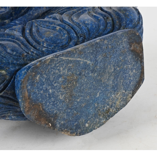 801 - A LARGE LAPIS LAZULI MODEL OF A BUDDHA20TH CENTURYSeated on a lotus thrown45cm high