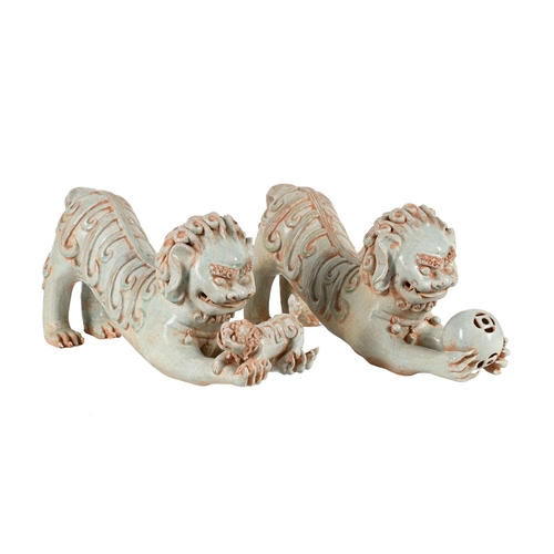 814 - A PAIR OF CHINESE PORCELAIN CELADON GLAZE MODELS OF LIONS AND CUBS20TH CENTURY 58cm long