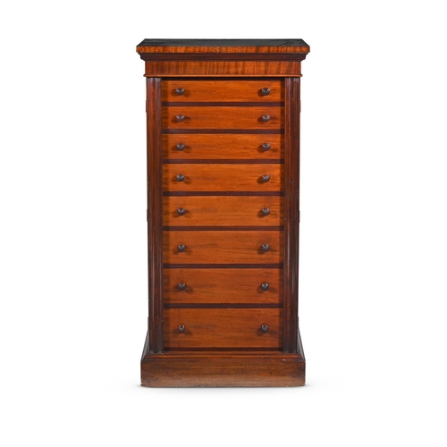 831 - A TALL EDWARDIAN MAHOGANY WELLINGTON CHEST STAMPED EDWARDS & ROBERTS, CIRCA 1905 Twin flaps flanking... 