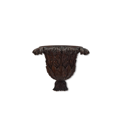 129 - A GRADUATED SET OF THREE CARVED MAHOGANY WALL BRACKETS OR CORBELS EARLY 20TH CENTURY Each of crisp c... 