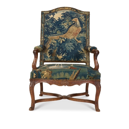 15 - A MATCHED PAIR OF WALNUT AND VERDURE TAPESTRY UPHOLSTERED ARMCHAIRS FRENCH, EARLY 18TH CENTURYOne wi... 