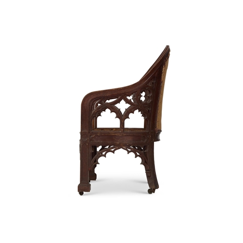 210 - A GEORGE III GOTHIC REVIVAL CARVED OAK LIBRARY ARMCHAIR EARLY 19TH CENTURY, IN THE MANNER OF JAMES W... 