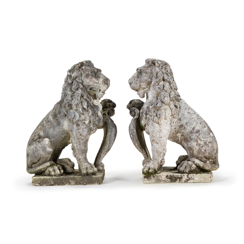 227 - A PAIR OF VENETIAN CAST STONE LIONS LATE 19TH CENTURY Modelled opposing, each modelled seated on the... 