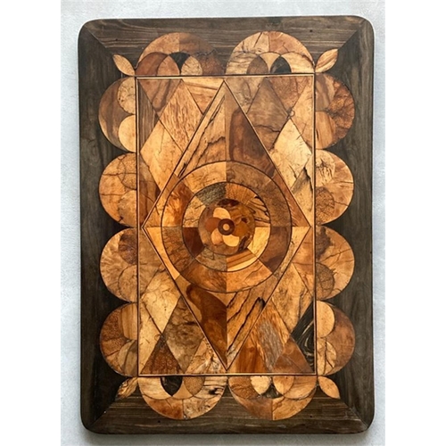 62 - Y AN EBONY AND SPECIMEN WOOD PARQUETRY INLAID TABLETOP PROBABLY SINHALESE, 19TH CENTURYThe top inlai... 