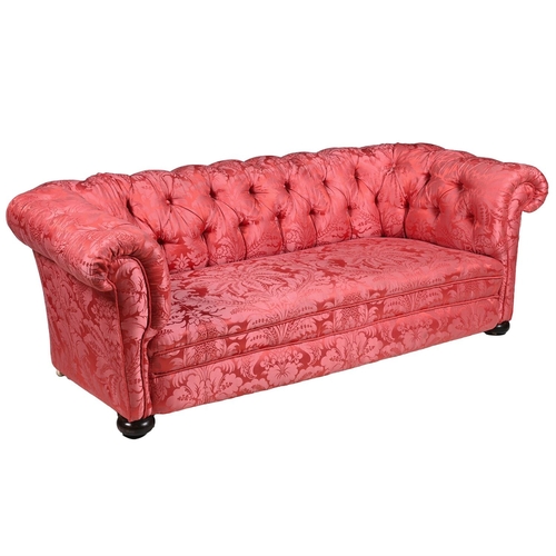 546 - A MAHOGANY AND RED DAMASK BUTTON UPHOLSTERED  SOFA LATE 19TH CENTURYOf 'Chesterfield' type With bun ... 