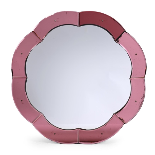 548 - A COLOURED AND CLEAR GLASS WALL MIRROR IN ART DECO TASTE 20TH CENTURYWith shaped glass marginal mirr... 