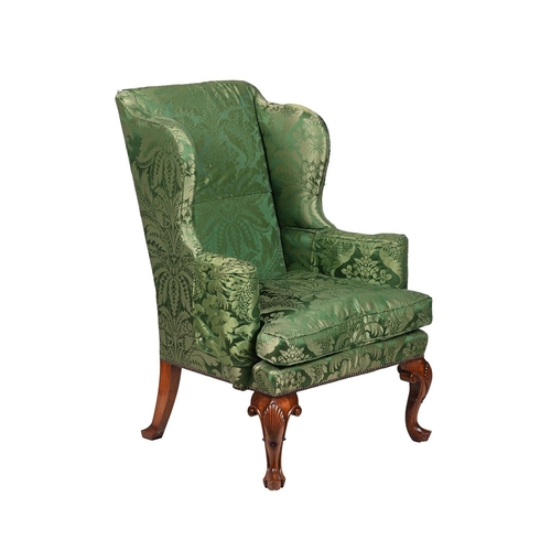 560 - A WALNUT WING ARMCHAIR IN GEORGE II STYLE MID 20TH CENTURYapproximately 115cm high, 82cm wide, 77cm ... 