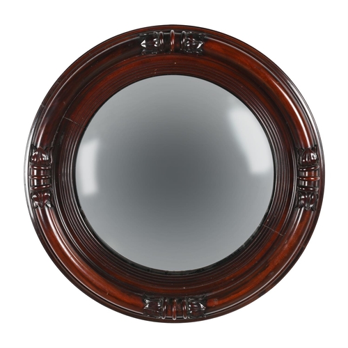 585 - A MAHOGANY FRAMED CONVEX MIRROR IN GEORGE IV STYLE LATE 19TH CENTURYIn the manner of giltwood exampl... 