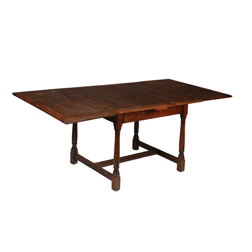 543 - AN OAK DRAWER LEAF DINING TABLEBY HEALS, CIRCA 192076.5cm high, 90.5cm wide, 198cm long extended