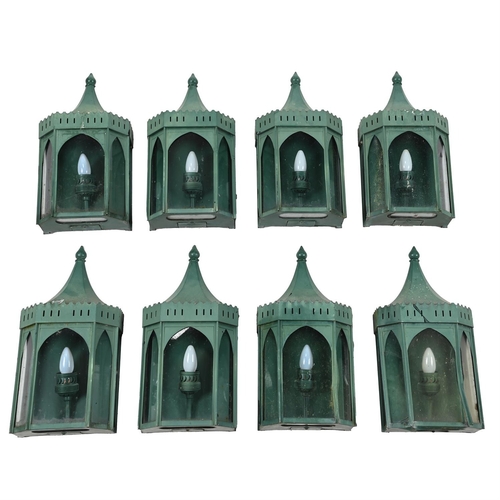 556 - A SET OF EIGHT GREEN PAINTED METAL WALL LANTERNSOF RECENT MANUFACTURE50.5cm high, 24.5cm wide, 12.5c... 