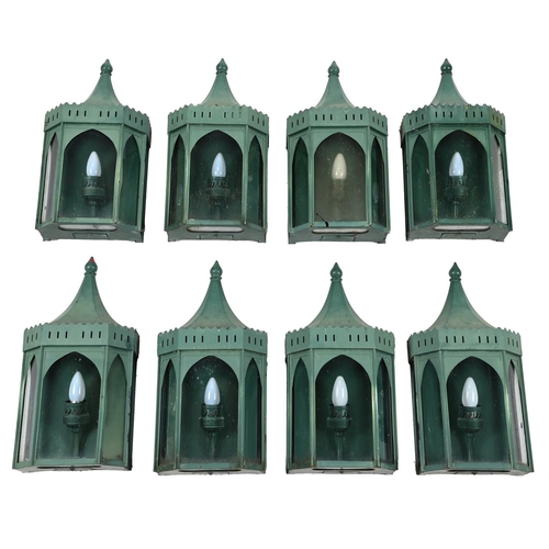 558 - A SET OF EIGHT GREEN PAINTED METAL WALL LANTERNSOF RECENT MANUFACTURE50.5cm high, 24.5cm wide, 12.5c... 