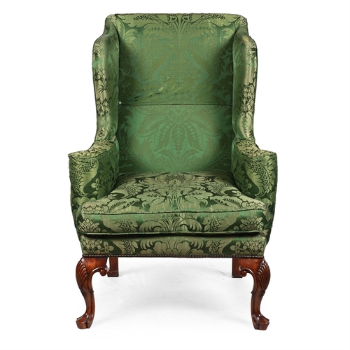 560 - A WALNUT WING ARMCHAIR IN GEORGE II STYLE MID 20TH CENTURYapproximately 115cm high, 82cm wide, 77cm ... 