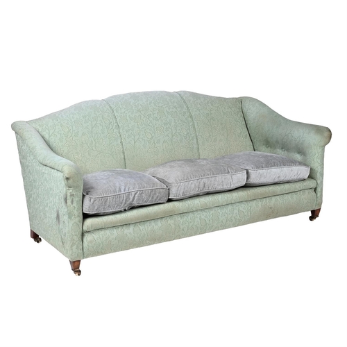 564 - AN EDWARDIAN WALNUT AND GREEN UPHOLSTERED SOFA CIRCA 1905, IN THE MANNER OF HOWARD & SONS93cm high, ... 