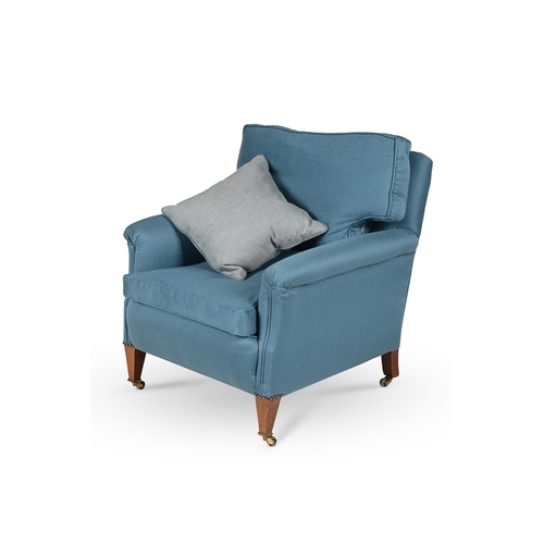 573 - A MAHOGANY AND BLUE UPHOLSTERED ARMCHAIR IN THE MANNER OF HOWARD & SONS, EARLY 20TH CENTURYOn square... 