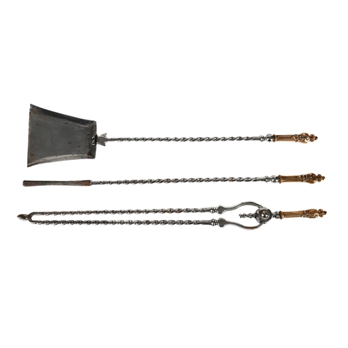 586 - A SET OF THREE VICTORIAN POLISHED STEEL AND BRONZE HANDLED FIRE TOOLS CIRCA 1850 Comprising shovel, ... 