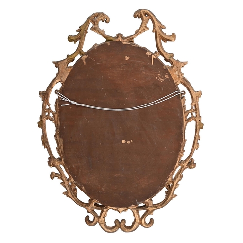 301 - A CARVED GILTWOOD OVAL MIRROR18TH CENTURY AND LATER103cm high, 78cm wide, 5cm deep