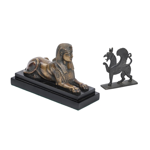 307 - A GILT BRONZE MODEL OF A SPHINX LATE 19TH CENTURYNow mounted on a later wood base 24cm longAND A BRO... 