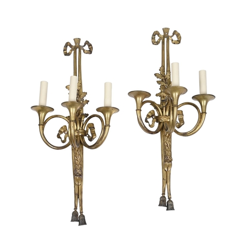 341 - A PAIR OF FRENCH ORMOLU THREE-BRANCH WALL LIGHTSIN LOUIS XVI STYLE, LATE 19TH CENTURYThe backplates ... 