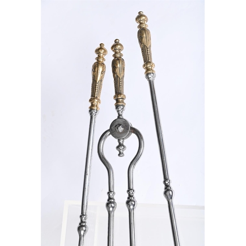 351 - A SET OF THREE REGENCY BRASS HANDLED STEEL FIRE TOOLSEARLY 19TH CENTURYWith foliate leaf clasped han... 