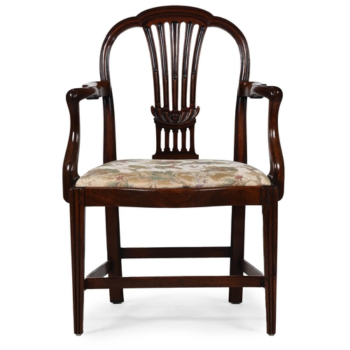 384 - A GEORGE III MAHOGANY OPEN ARMCHAIR, IN THE MANNER OF GEORGE HEPPLEWHITECIRCA 1800 With vertical spl... 