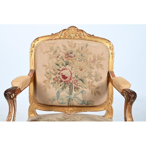 390 - A CARVED GILTWOOD AND TAPESTRY UPHOLSTERED FAUTEUIL IN REGENCE STYLE, 19TH CENTURY99cm high, 63cm wi... 