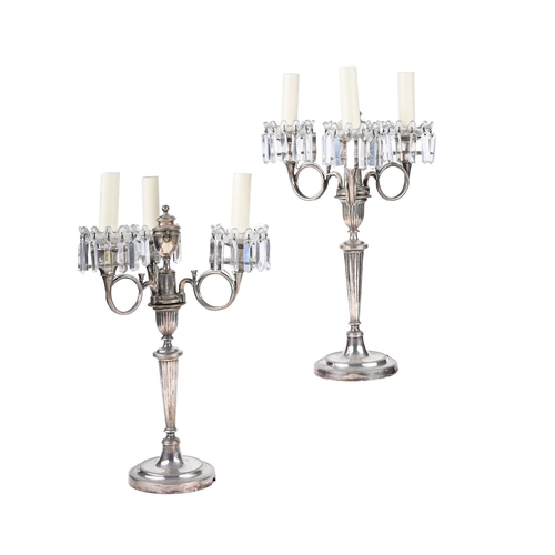 415 - A LARGE PAIR OF SILVER-PLATED FOUR-LIGHT CANDLESTICKS19TH CENTURY AND LATERNow fitted for electricit... 