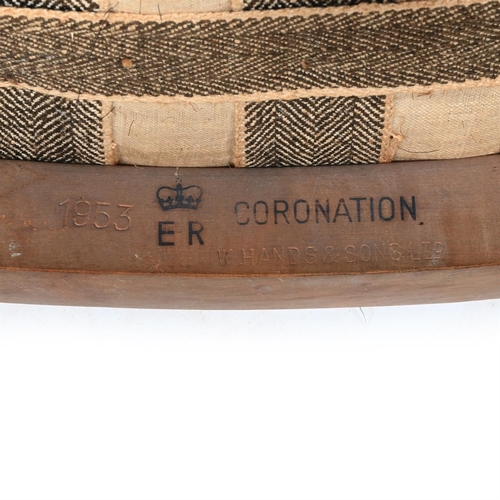 424 - AN ELIZABETH II LIMED OAK CORONATION CHAIR BY W. HANDS & SONS LTD, CIRCA 1953Numbered button '370' t... 