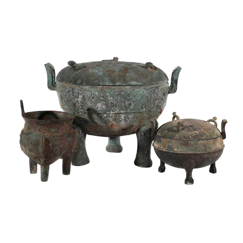 603 - THREE LARGE CHINESE ARCHAISTIC BRONZE RITUAL FOOD VESSELS AND COVERS42.5cm wide and smaller TOGETHER... 