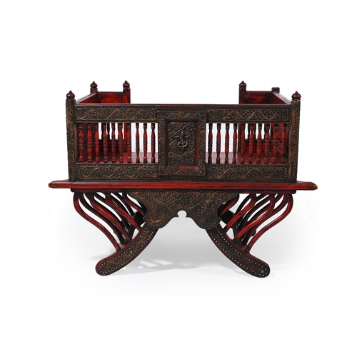 604 - A STAINED AND CARVED WOOD CHAIR IN THE FORM OF A HOWDAH LATE 20TH CENTURY With spindled gallery abov... 