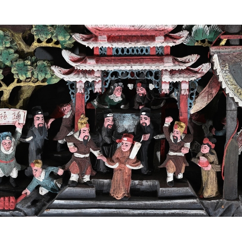 605 - A CHINESE CARVED WOODEN POLYCHROME PAINTED DEEP RELIEF PANEL25.5cm high, 104cm wide, 10cm deepTOGETH... 