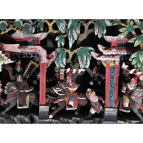 605 - A CHINESE CARVED WOODEN POLYCHROME PAINTED DEEP RELIEF PANEL25.5cm high, 104cm wide, 10cm deepTOGETH... 