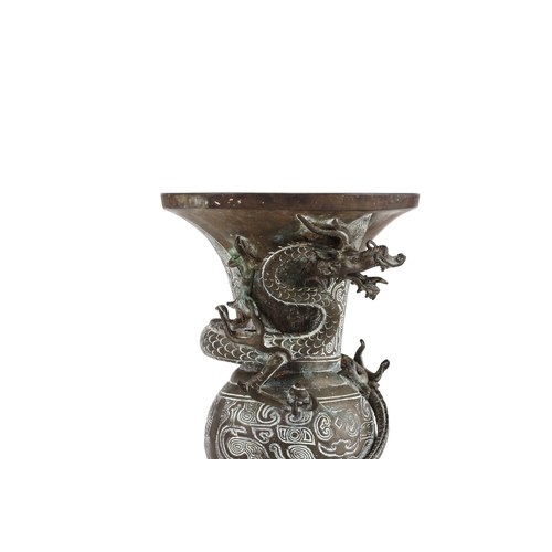 607 - A CHINESE BRONZE GU VASELATE QING DYNASTYMoulded to the body with a dragon20.8cm high, weight 1557.5... 