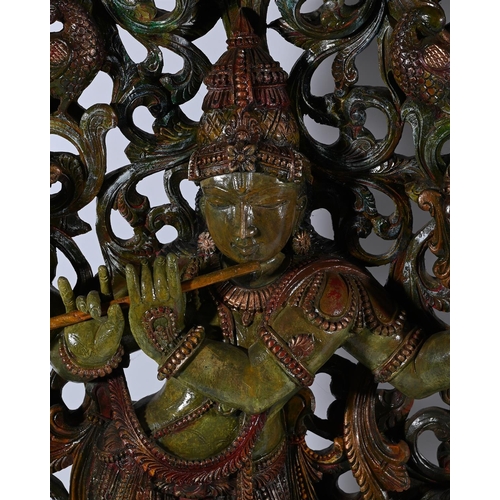 611 - A PAIR OF POLYCHROME PAINTED CARVED MANGO WOOD PANELSDEPICTING KRISHNA AND GANESHeach approximately ... 