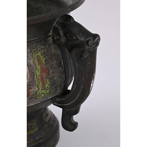 621 - A CHINESE BRONZE TWO HANDLED CHAMPLEVE CENSERLATE 19TH CENTURYEnamelled with Taotie mask to the exte... 