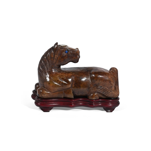 628 - A LARGE CHINESE BROWN JADE BOULDER CARVING OF A HORSE 20TH CENTURYRecumbent with head turned back an... 