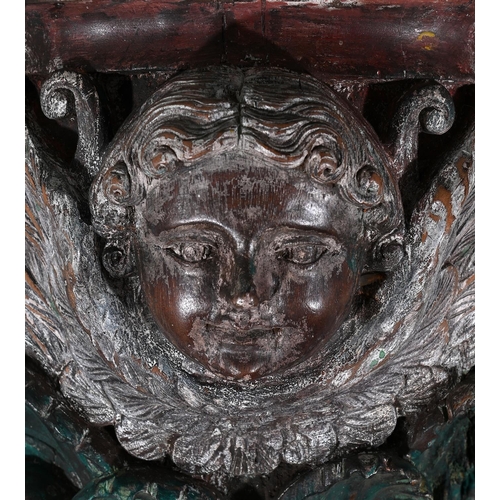 645 - A HAND CARVED POLYCHROME PAINTED WOODEN WALL BRACKET20TH CENTURYWith the face of a cherubapproximate... 