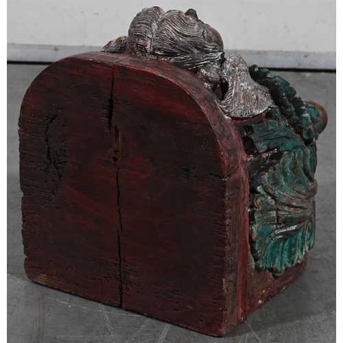 645 - A HAND CARVED POLYCHROME PAINTED WOODEN WALL BRACKET20TH CENTURYWith the face of a cherubapproximate... 