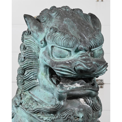 646 - A VERY LARGE PAIR OF PATINATED METAL GARDEN MODELS OF CHINESE GUARDIAN LIONS OR FOO DOGS20TH CENTURY... 