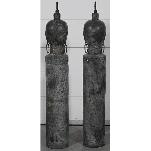 649 - A PAIR OF THAI VERDIGRIS PATINATED BRONZE SLIT DRUMSModelled with a Buddha head atop of a columnar b... 