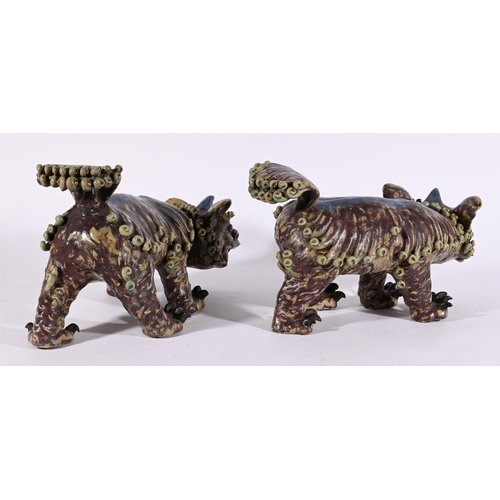 652 - A PAIR OF DECORATVE CHINESE GLAZED POTTERY LIONS20TH CENTURYGlazed in turquoise and purpleapproximat... 