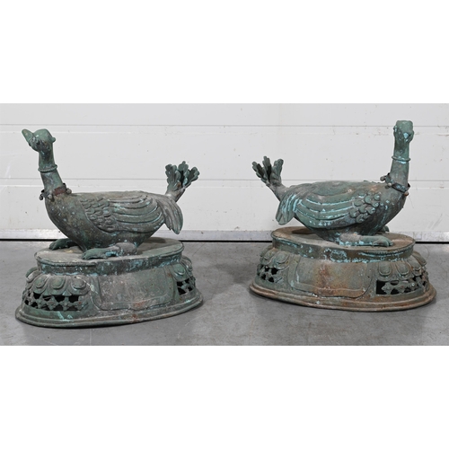 654 - A PAIR OF PATINATED METAL ASIATIC PHEASANTS20TH CENTURYModelled sitting atop a basket each approxima... 